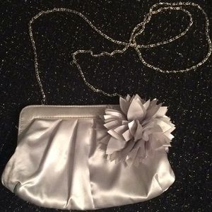 Charming Charlie silver special occasion bag.